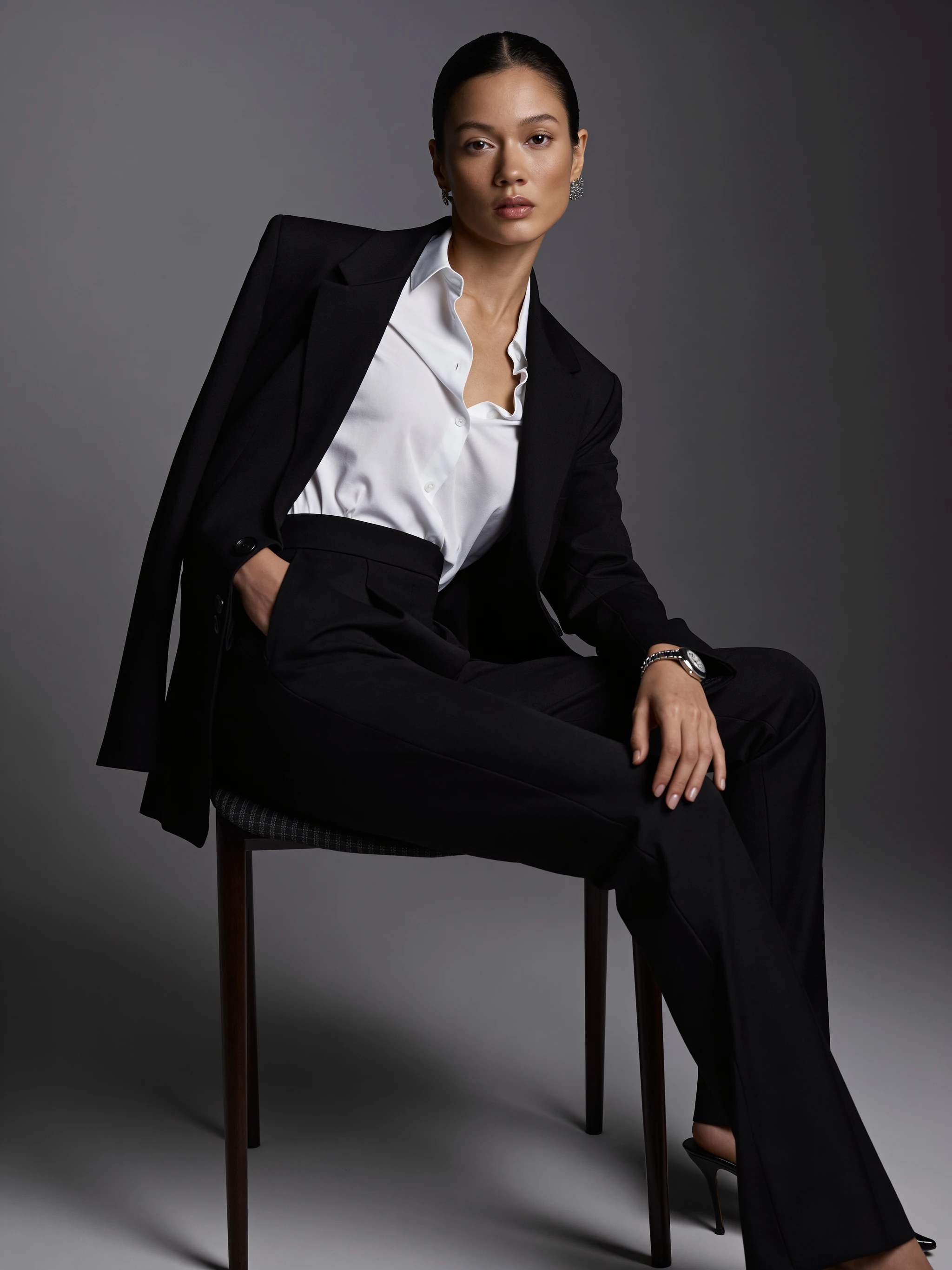 Model wearing tailored black trousers